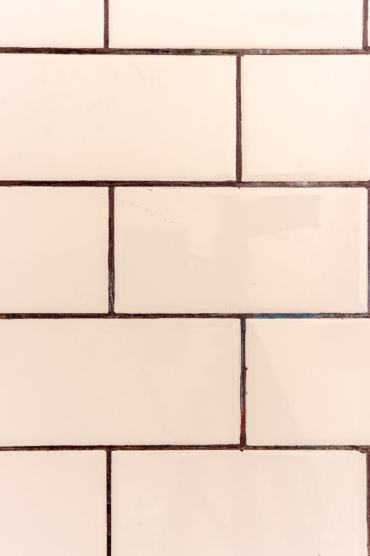 pink subway tile with dark grout lines by living letter