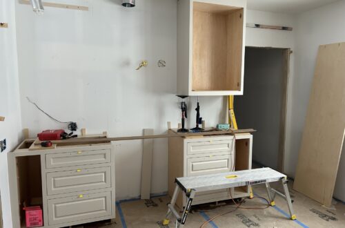 kitchen renovation in progress cabinets being installed