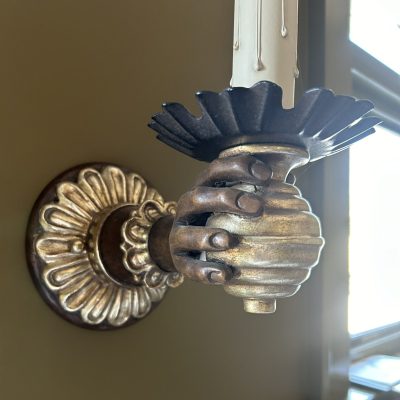 carved hand sconce with gilt finish