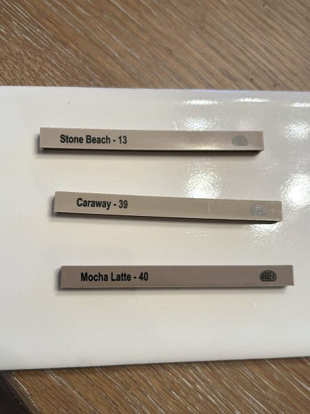 3 Ardex grout samples on a creamy white tile